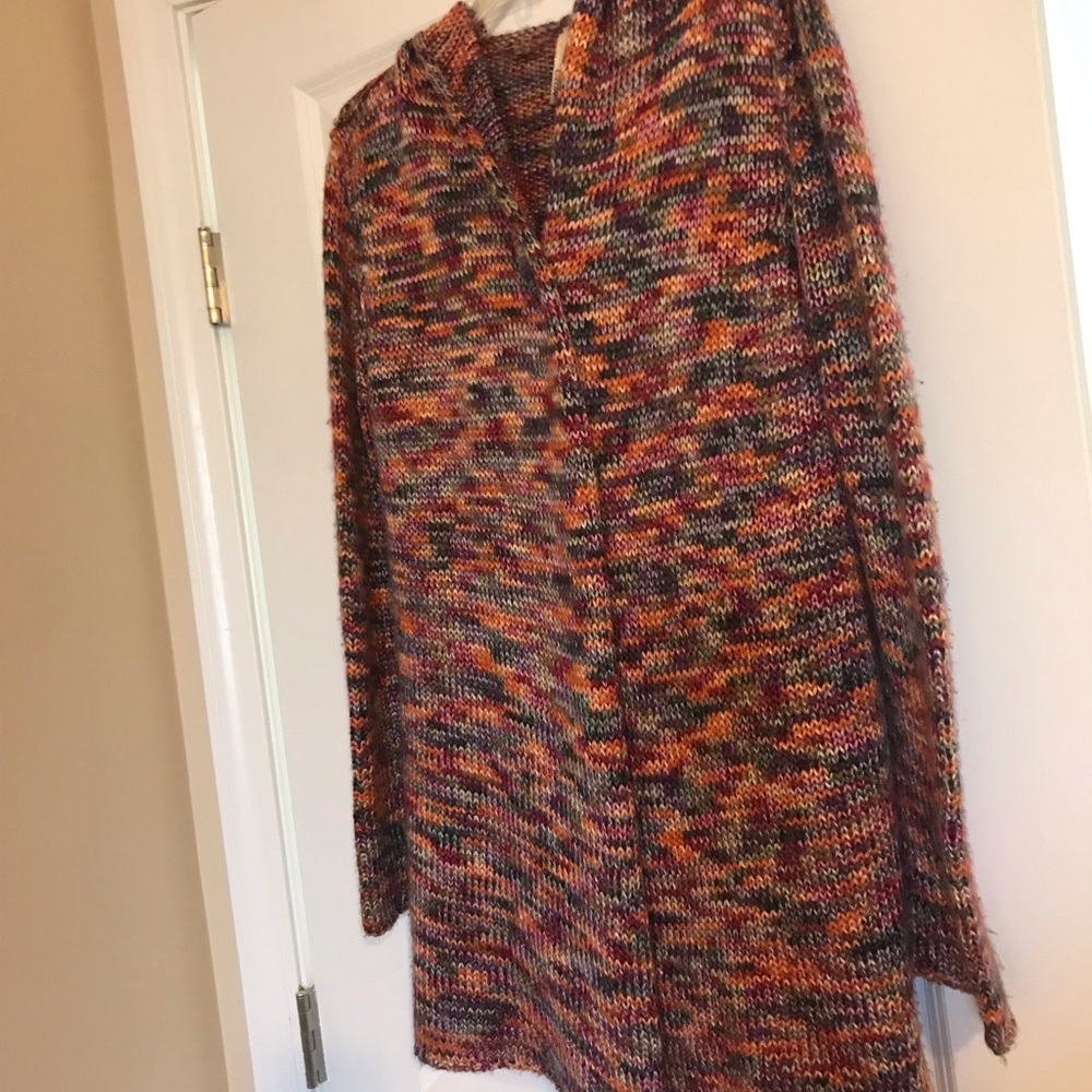 Elan multi cardigan sweater with pin closure.